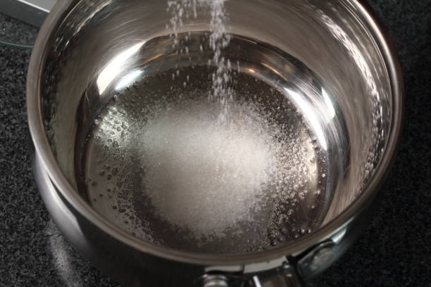 istock Pouring Sugar into Water Dipper 1082312688