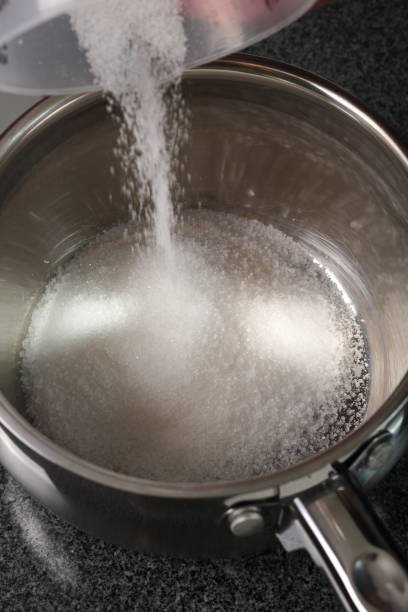 istock Pouring Sugar into Water Dipper 1082312764