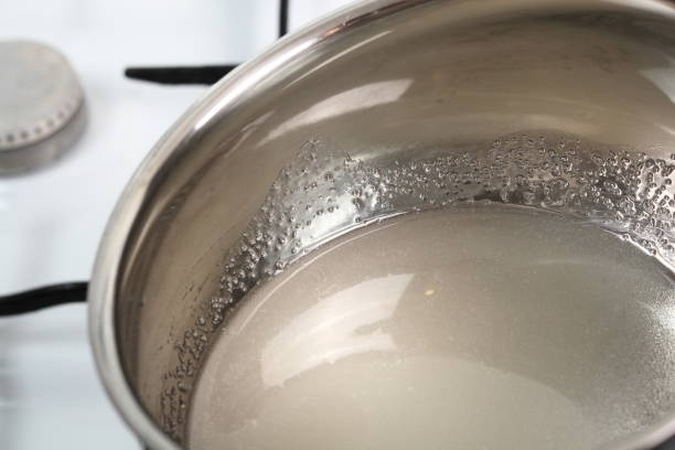 istock Dissolving sugar in water on low heat. Making Golden Syrup Series. 1082313244