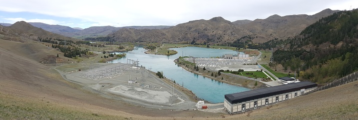 Hydroelectric power plant on river lake in Benmore Lake, New Zealand. Renewable resources for electricity. Power generation using natural power.