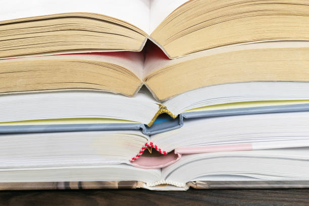 istock a stack of hardcover books on a wooden table 1082319602