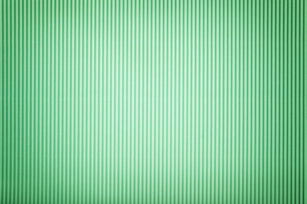 istock Texture of corrugated green paper with vignette, macro. 1082321900