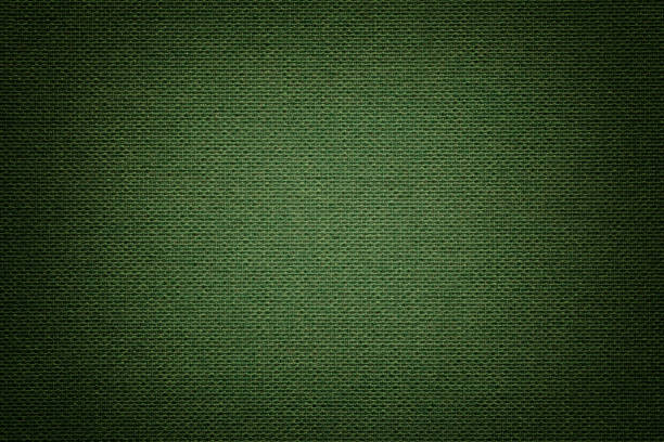 fondo verde oscuro de un material textil. tela con textura natural. telón de fondo. - cotton smooth green plant fotografías e imágenes de stock