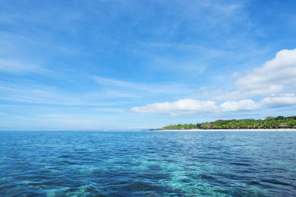 istock Tropical Paradise Island And Blue Sky Landscape 1082323026