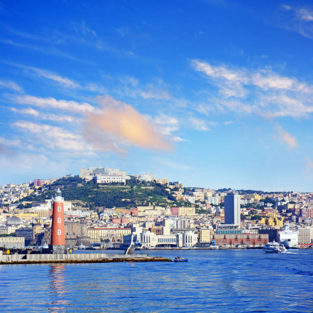 Molo San Vincenzo lighthouse in Port of Naples (Porto di Napoli), Italy. Composite photo