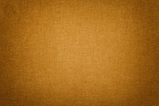 istock Dark orange background from a textile material. Fabric with natural texture. Backdrop. 1082325518