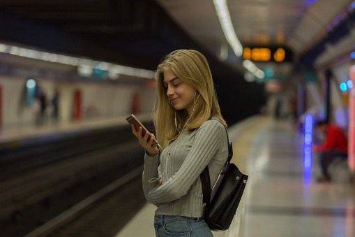 Young woman waiting at subway station