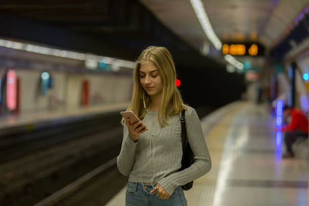 istock Young woman waiting at subway station 1082325688