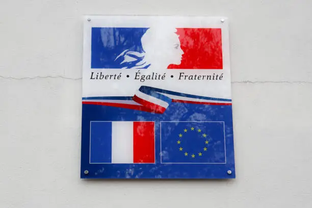 Photo of the france and europe flag with writing  liberte egalite fraternite means in french freedom equality fraternity