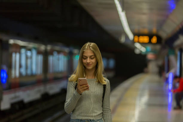 Young woman waiting at subway station