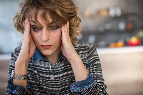istock Depressive woman at home 1082326376