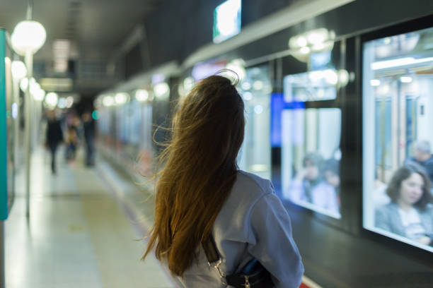 istock Young woman at the subway station 1082327678