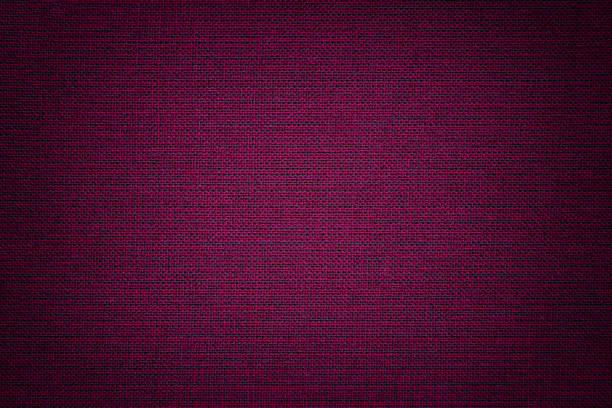 Dark purple background from a textile material. Fabric with natural texture. Backdrop. Dark purple background from a textile material with wicker pattern, closeup. Structure of the wine fabric with texture. Cloth backdrop with vignette. flax weaving stock pictures, royalty-free photos & images
