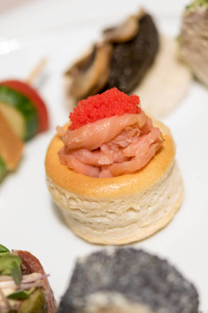istock Different types of canapes, placed on white plates, finger food 1082331320