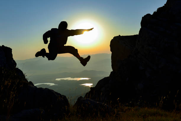 istock peak mountains, target success, tenacious people and creative energetic jump 1082333894
