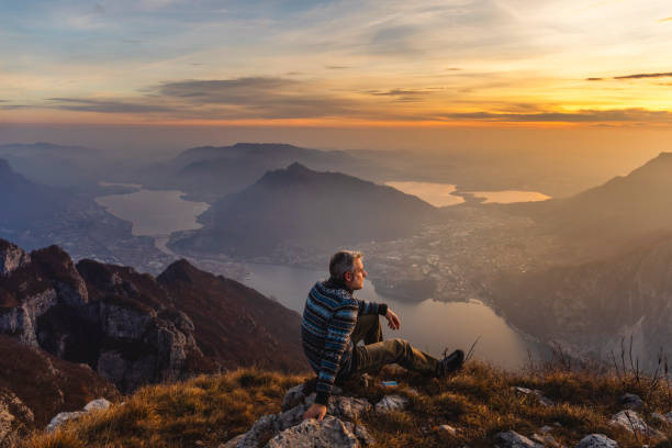istock Man hiker solo on the mountain during golden hour 1082336192