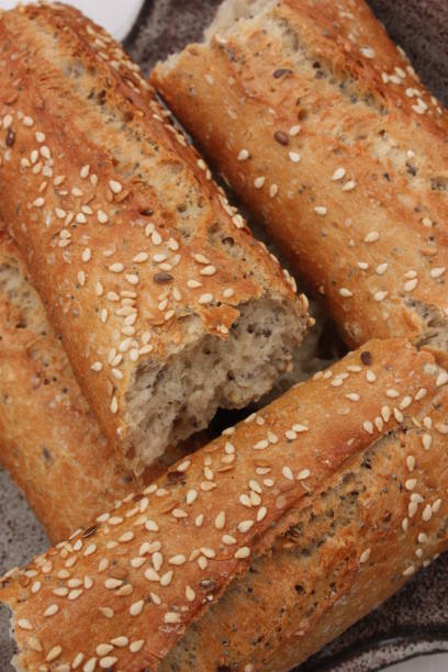 istock Baguette bread in pieces with sesame seeds 1082336376