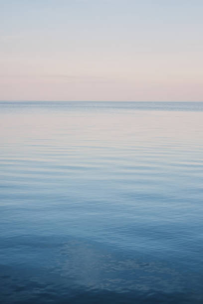 istock Blue sky landscape without clouds spreading on the sea 1082337150