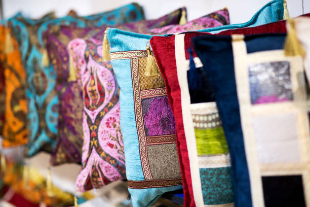 istock Row of colorful hand-made pillows 1082337340