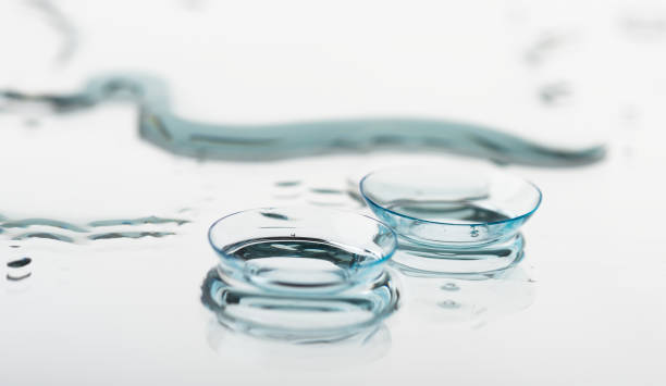 Two contact lenses with reflections stock photo