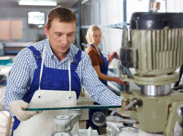 istock Ordinary male engaged  on industrial machine 1082340498