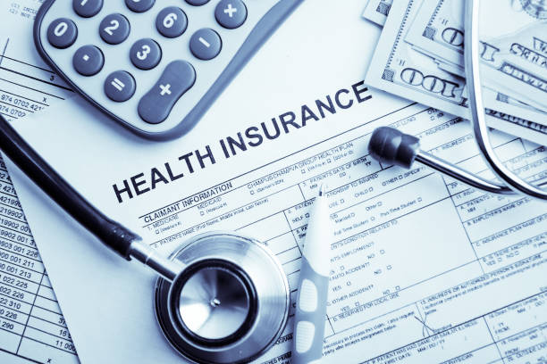 istock Health insurance application form with banknote and stethoscope concept for life planning 1082342020