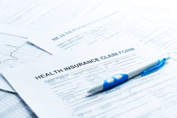 health insurance form, paperwork and questionnaire for insurance concepts health insurance form, paperwork and questionnaire for insurance concepts claim form photos stock pictures, royalty-free photos & images
