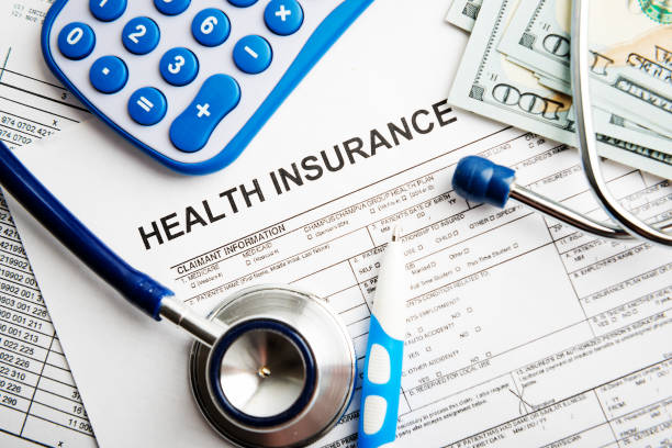 istock Health insurance application form with banknote and stethoscope concept for life planning 1082342100