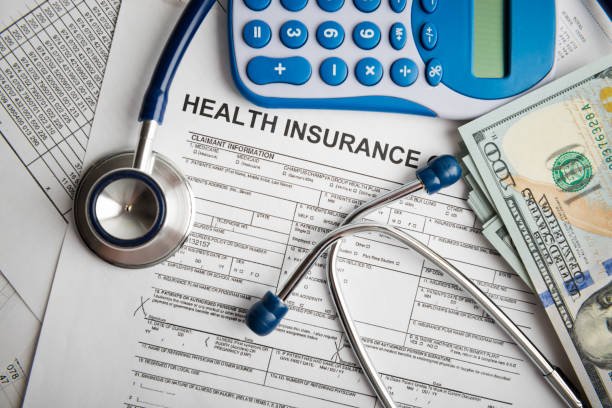 istock Health insurance application form with banknote and stethoscope concept for life planning 1082342112
