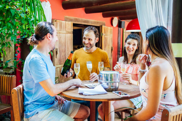 istock Brazilian friends drinking champagne 1082344102