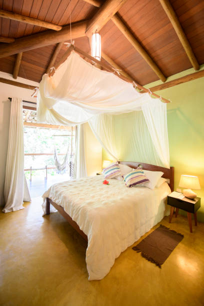 istock Double bed in hotel room with canopy 1082344426