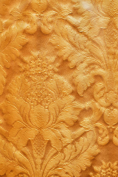 istock Seamless pattern. Golden textured curls. Brilliant lace, stylized flowers. Openwork weaving delicate, golden background, 1082351488
