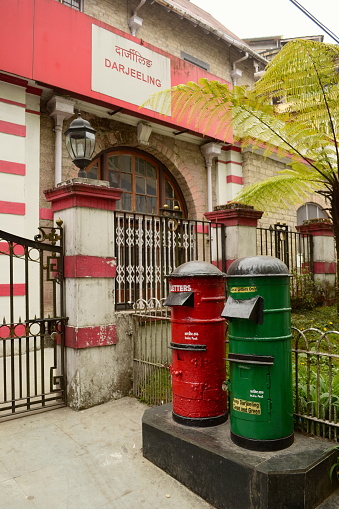 Red and green mailboxes near post office. Darjeeling, India.