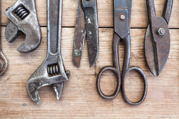istock Close up view vintage rusted tools on old wooden table. 1082357214