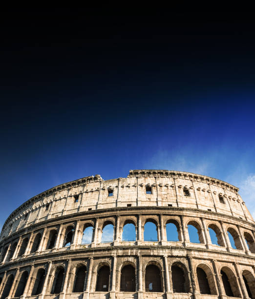 coliseum in rome with blue sky