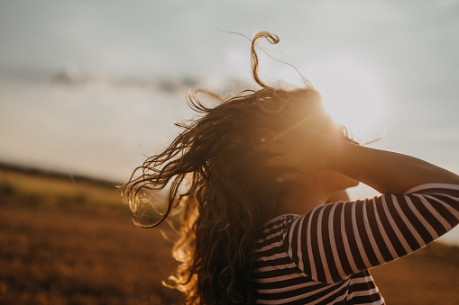 Photo of young woman in the field