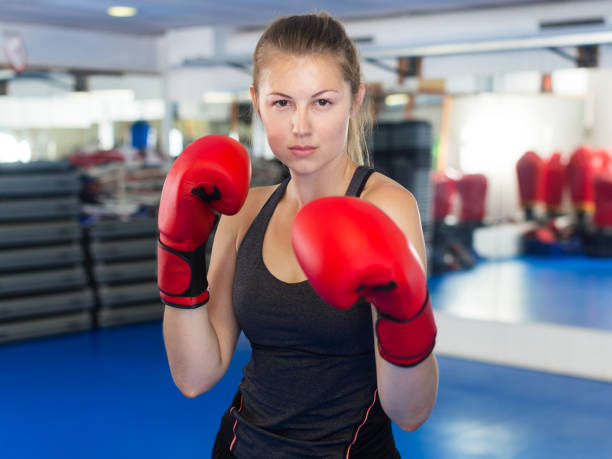 istock Woman boxing in gym 1082359662