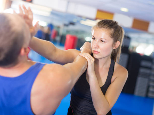 istock Attractive female is fighting with trainer 1082359718