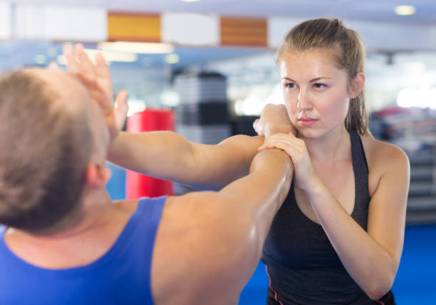 istock Happy woman is fighting with trainer 1082359740
