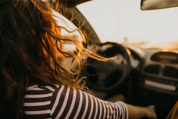istock Young women on a road trip with cabriolet 1082359972