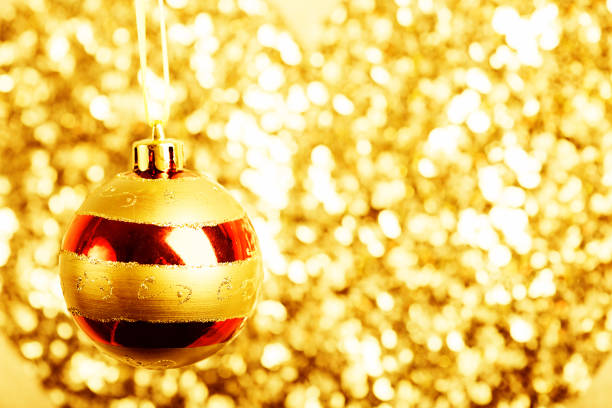 istock Christmas ball on golden blurred background 1082362848