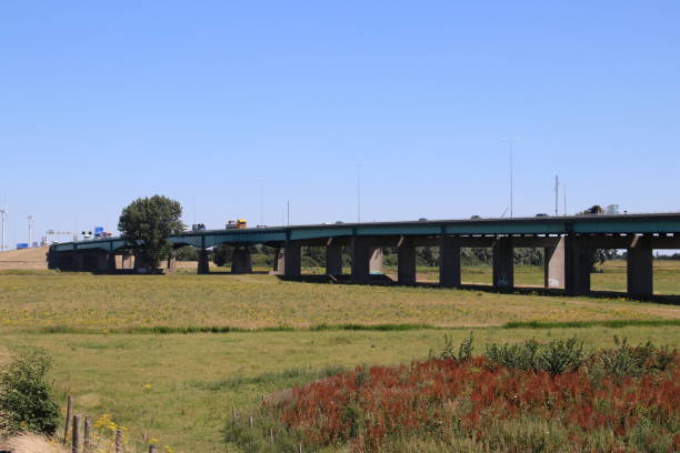 istock Bridge under motorway A27 at Houten in the netherlands over river Lek 1082364970
