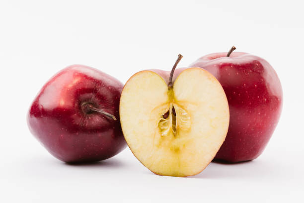 istock cut and whole red delicious apples on white background 1082382430