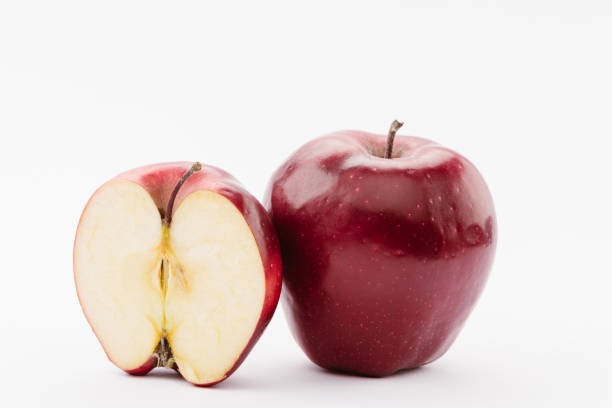 istock half and whole ripe red delicious apples on white background 1082382464