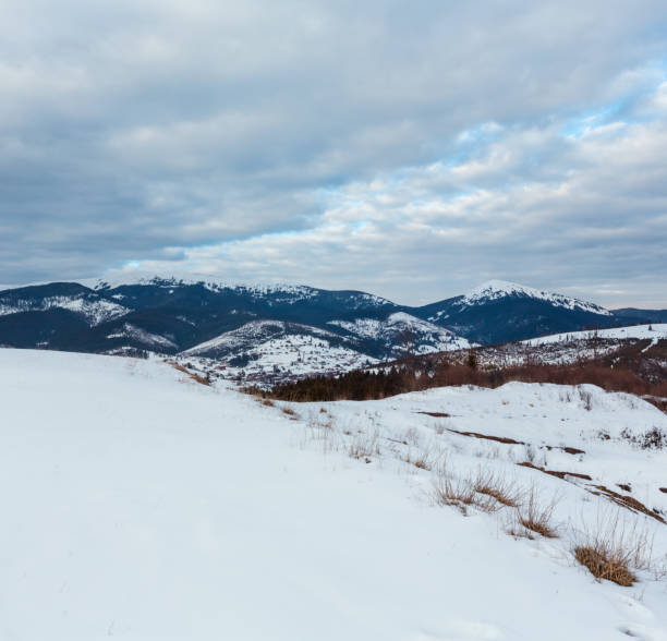 Evening winter cloudy day mountain ridge