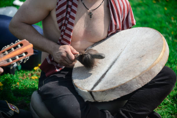 istock The man is playing the tambourine 1082392808