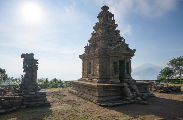 istock Candi Gedong Songo at sunrise. A 9th-century Buddhist temple complex with Mounts Merbabu and Merapi. 1082393510