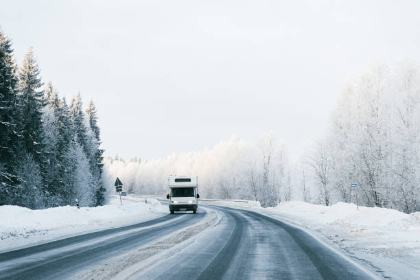 istock Caravan in a road winter Rovaniemi 1082398706