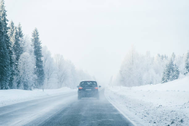 istock Car in a road a snowy winter Lapland 1082398708
