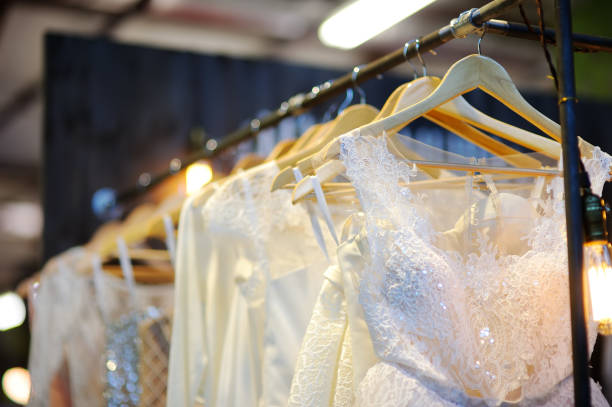 istock Few beautiful wedding dresses on a hanger. 1082401550